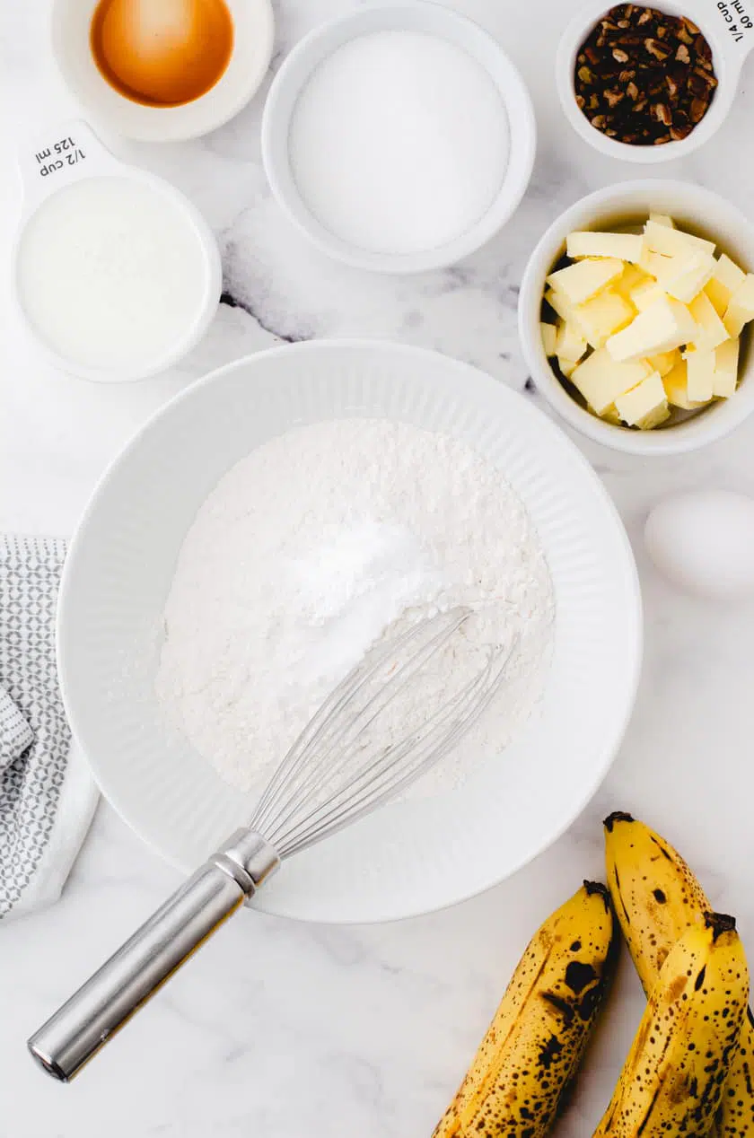 Step one in buttermilk banana bread recipe - mix together dry ingredients.