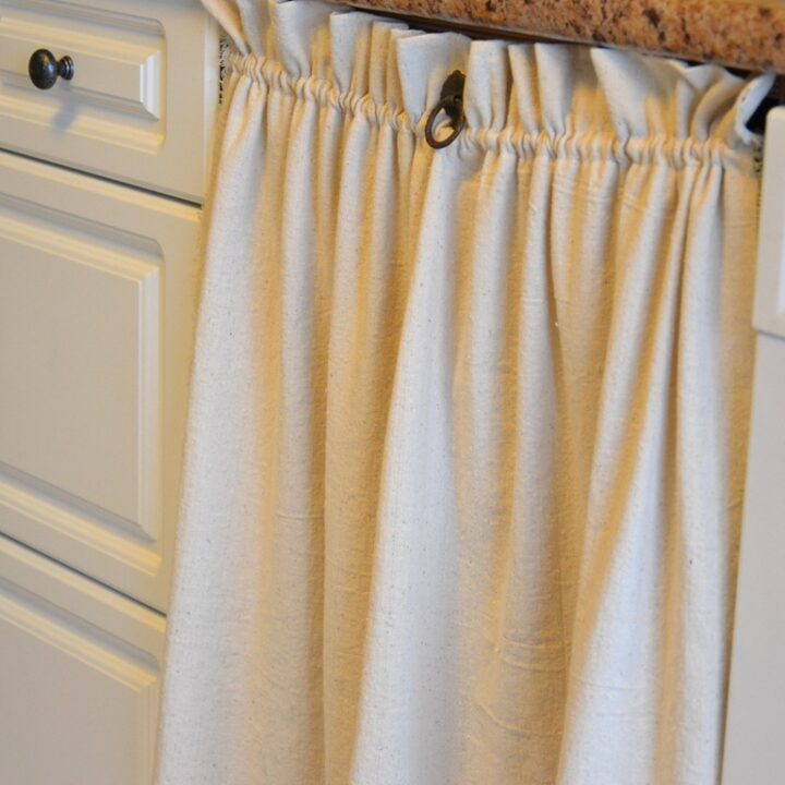 Cabinet curtain with drawer pull