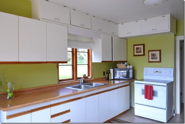 green kitchen with cupboards