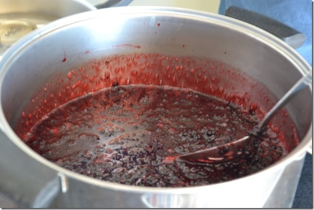 A pot of blackberries simmering to make blackberry jam.
