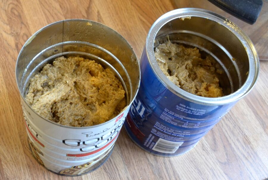 steam pudding batter portioned into coffee cans