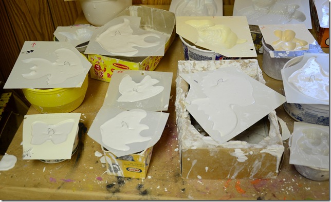 Plaster of paris moulds filled with liquid plaster of paris that are drying