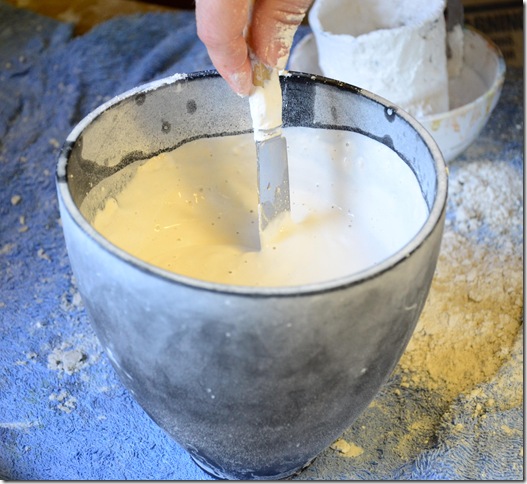 Liquid plaster of paris mixture ready to be poured into a mould