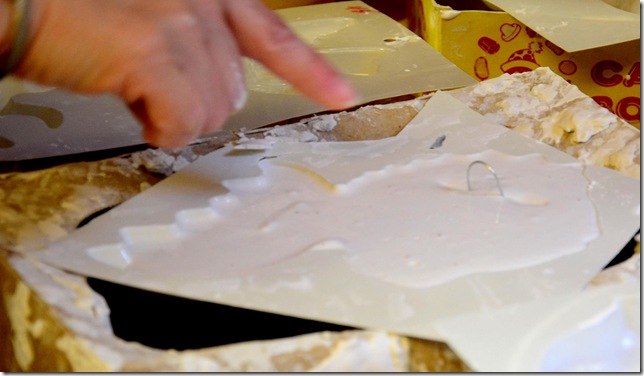 wire hanger in the back of a plaster mould