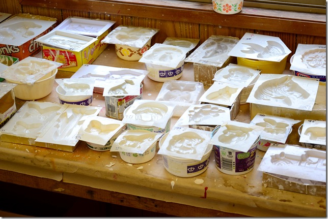 plaster of paris moulds lined up on a table