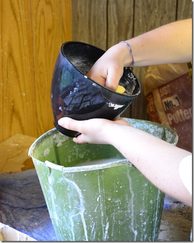 rinsing out the rubber plaster of paris rubber mixing bowl
