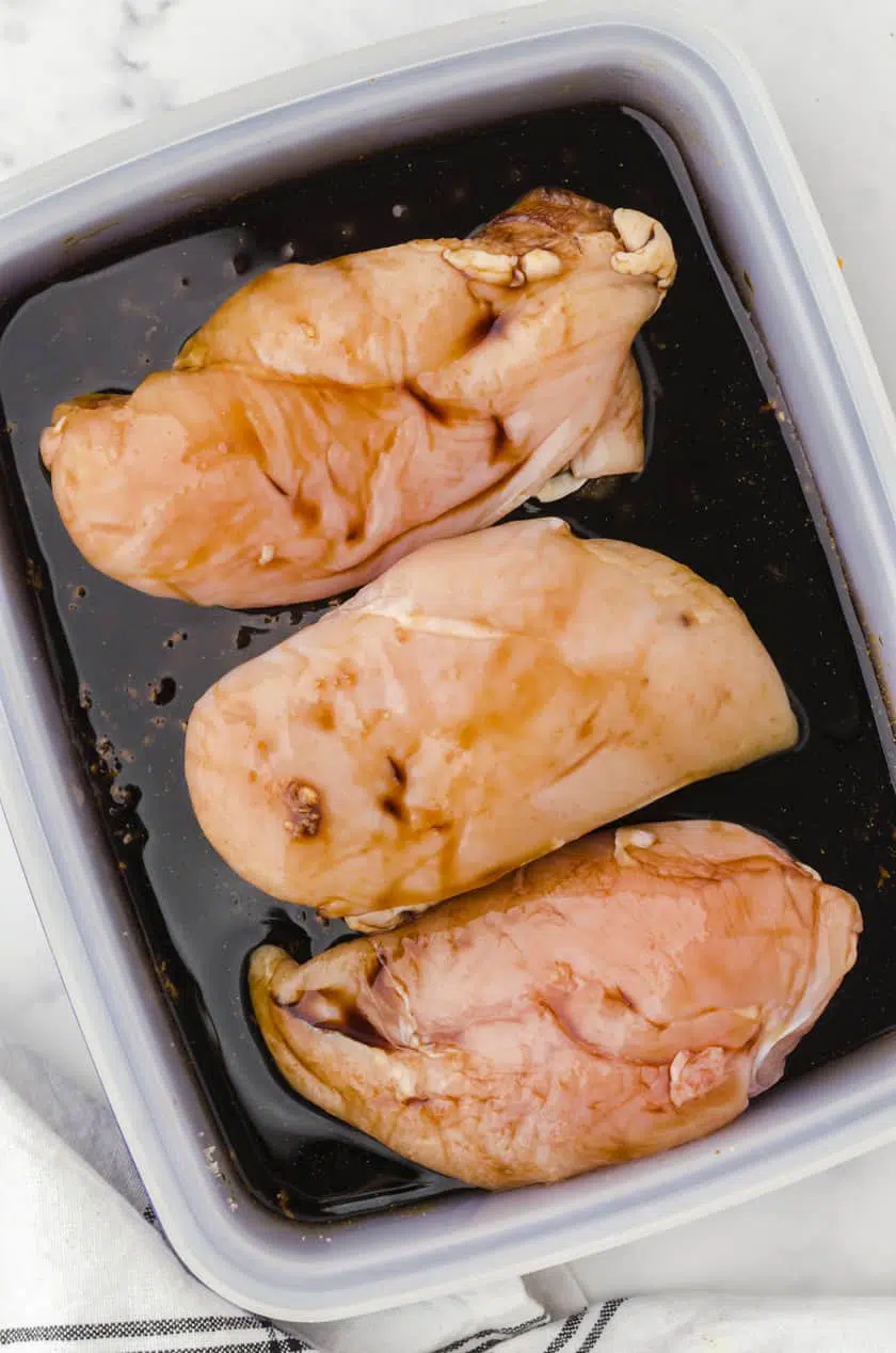 Place the chicken in the container with marinade and flip over so both sides are coated well.