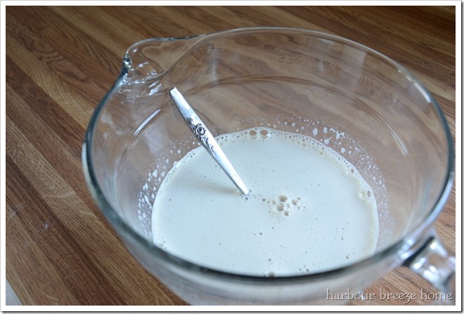 Vanilla pudding ingredients that have been stirred into warmed milk and ready to put back in the microwave for an easy microwave pudding recipe.