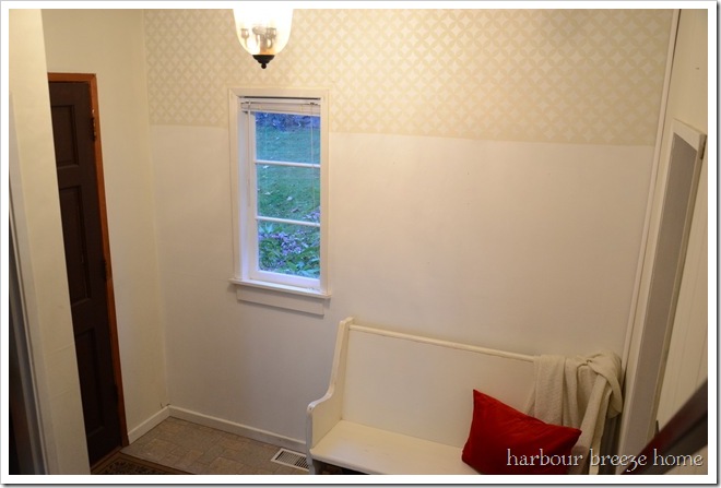 stenciled wall in entry