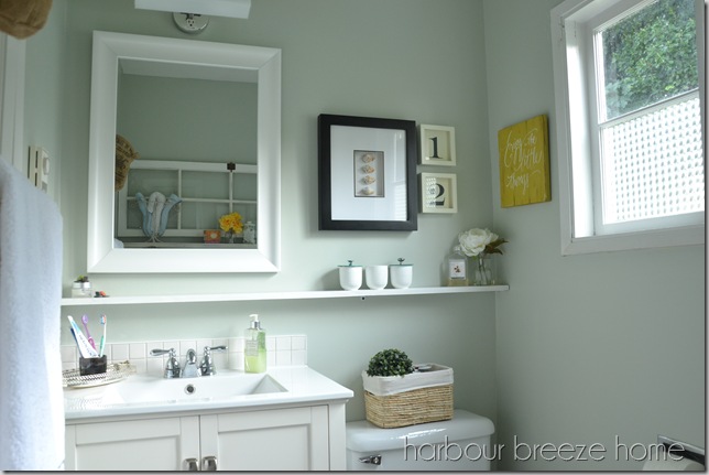 small bathroom vanity area with a shelf underneath