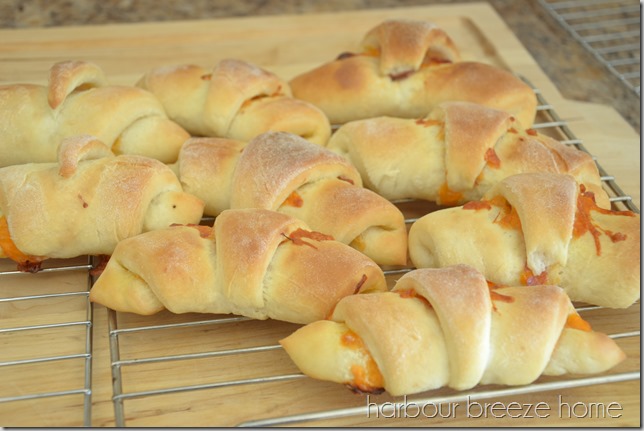 ham and cheese crescent rolls on a cooling rack.