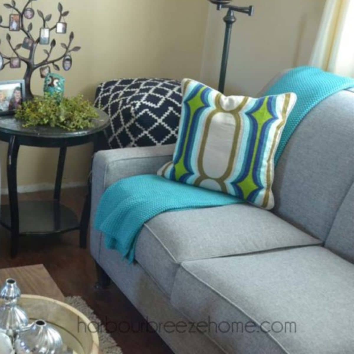 gray couch with modern pillow for a modern farmhouse style idea