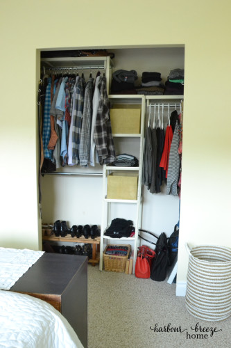 A Closet organizer with covered baskets and hanging racks organized nicely. /5 Simple Ways to Organize a Small Master Bedroom at harbourbreezehome.com