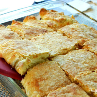 Cheeseburger casserole baked and sliced in a casserole dish ready to be served.