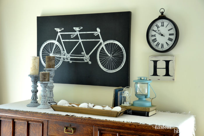 How to hang pictures on the wall: Are you paralyzed from hanging pictures on the wall for fear you'll put a nail in the wrong place? If so, this life hack will rock your socks off! Learn how to quickly and simply hang pictures in exactly the place you want using simple tools around the house. Click to read the easiest method ever! how to hang a picture on the wall