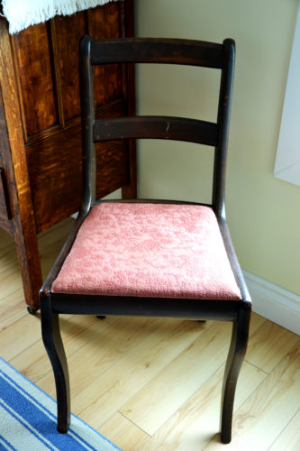 An heirloom dining room chair before it gets a new reupholstered seat cushion.