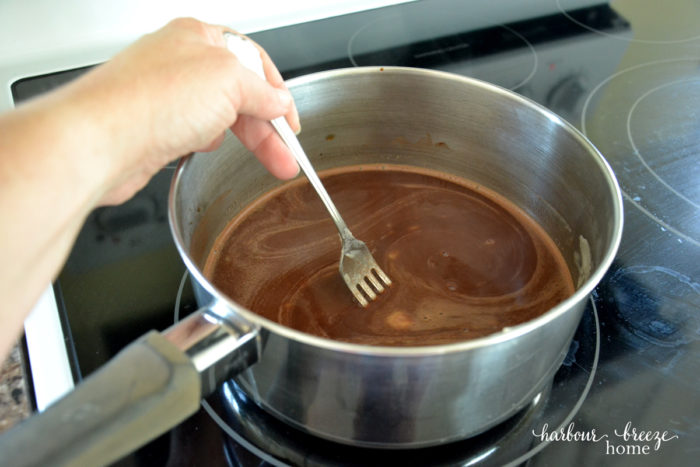 melting ingredients in a saucepan for texas sheet cake recipe