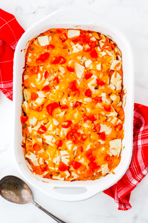 Baked Mexican Chicken Casserole topping with chopped fresh tomatoes.
