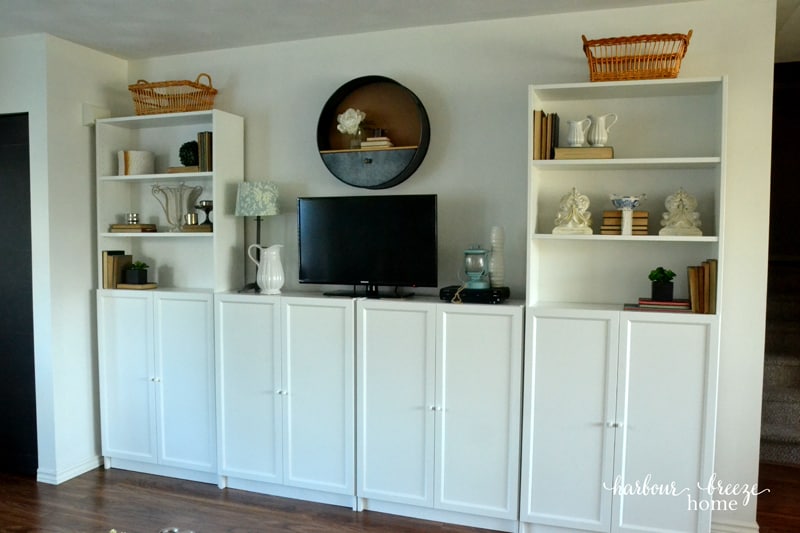 Ikea billy bookcases in against a wall in a townhouse.