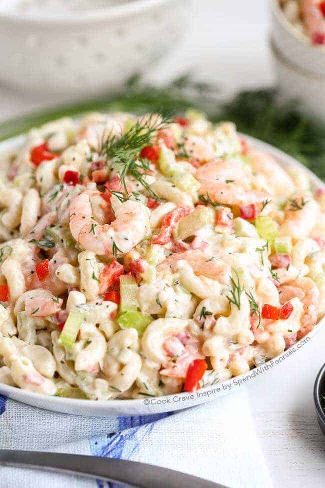 Shrimp salad garnished with parsley in a white bowl