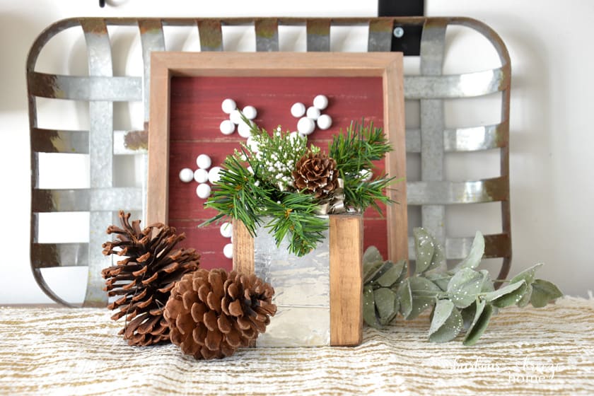 wood block gift farmhouse decor sitting in front of a metal tray on a table