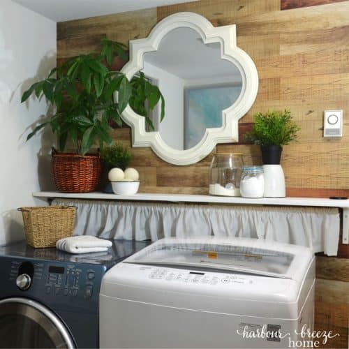 small laundry room with wooden plank wallpaper