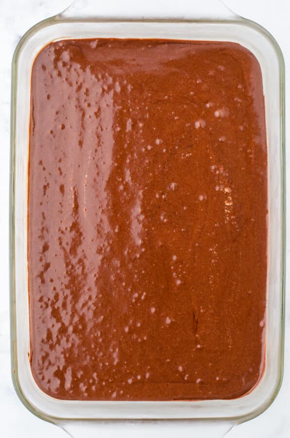 Chocolate layer in a 9x13 inch pan for a mocha refrigerator dessert recipe.