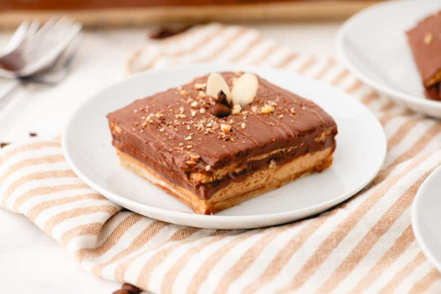 A piece of mocha dessert on a dessert plate.