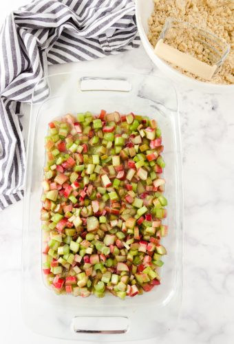 Diced rhubarb in pan after it has been stirred with sugar