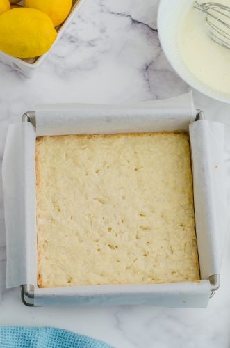 The shortbread crust for lemon squares after it has been baked.