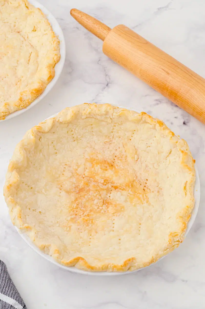 Baked pie shell that is golden brown.