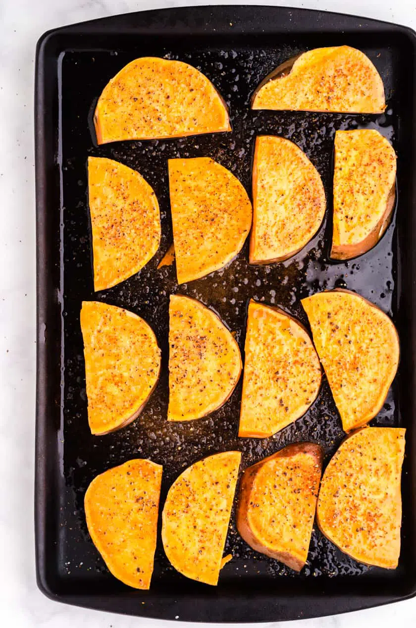 Sliced sweet potato on baking sheet