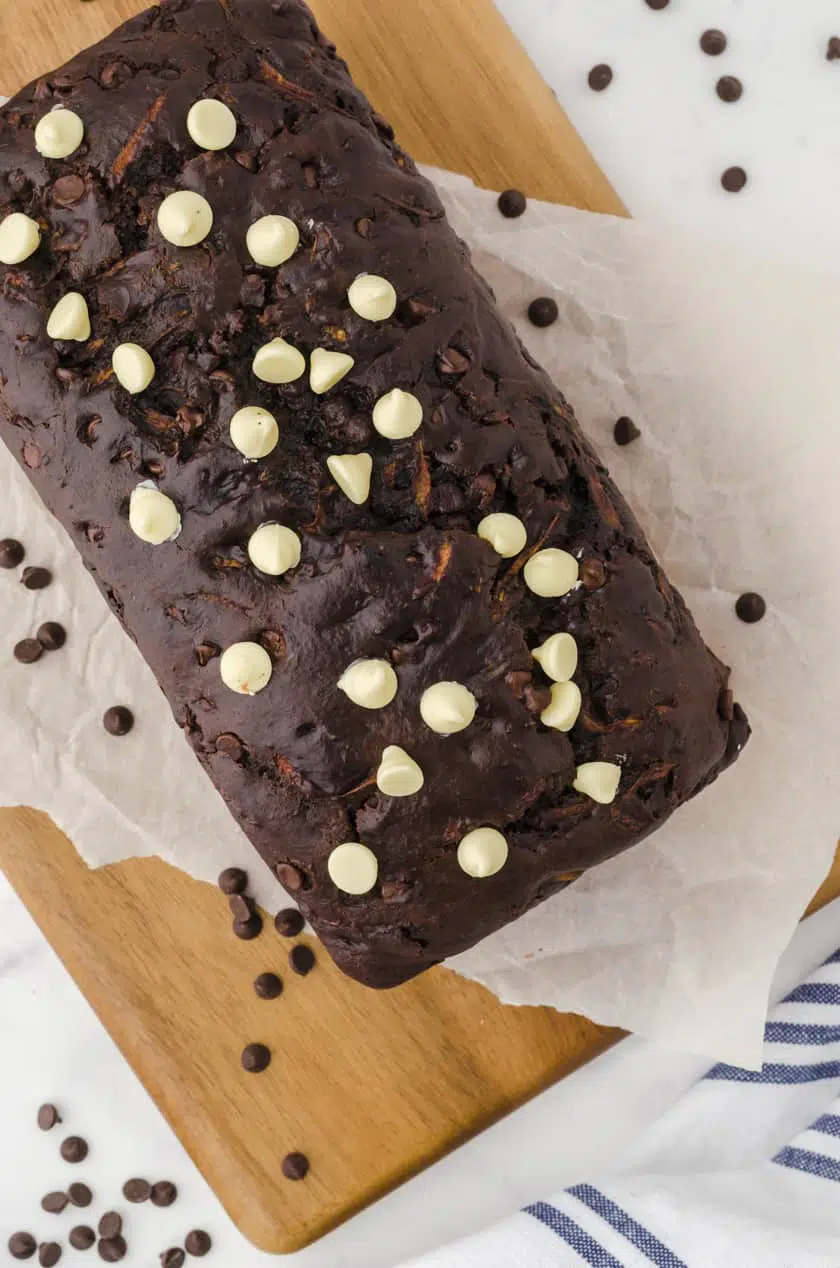 a loaf of chocolate zucchini bread on a cutting board