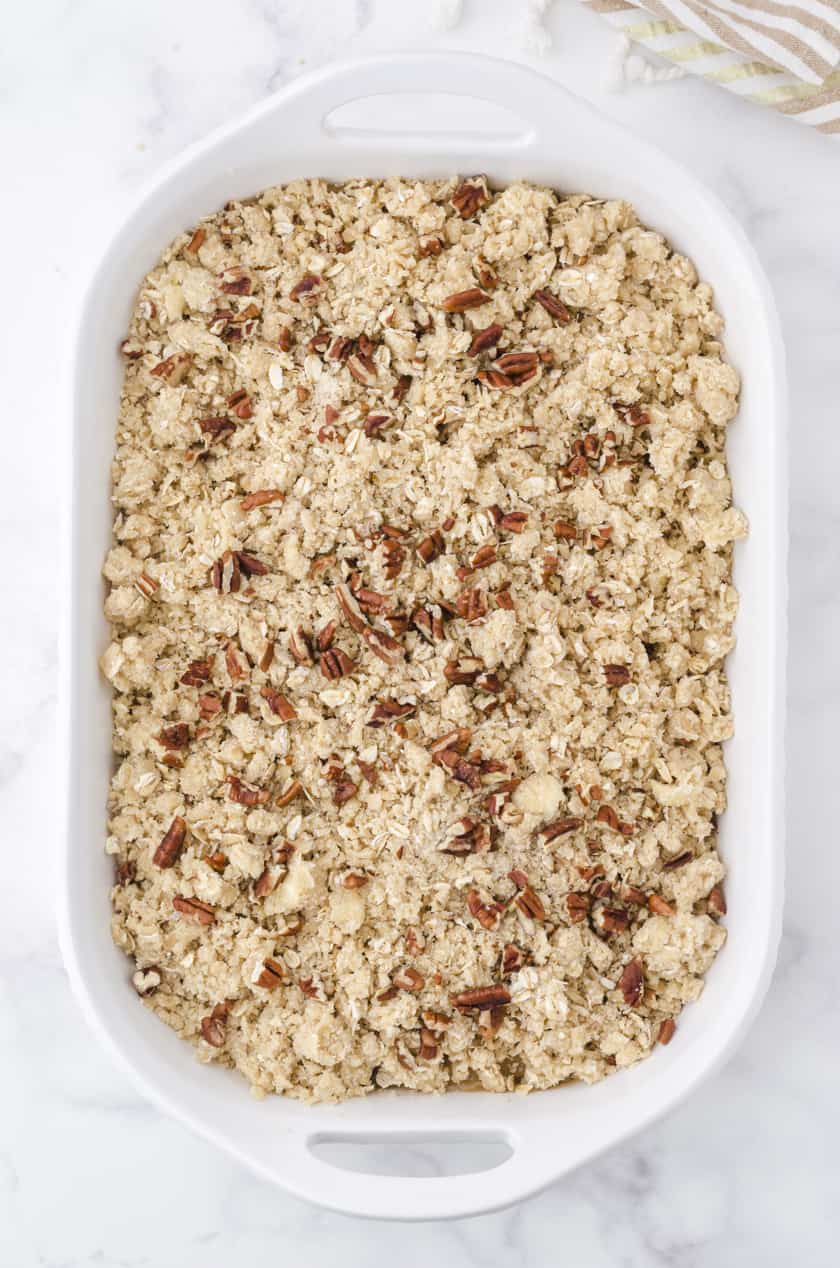 Pan of apple crisp assembled and ready to put in the oven.