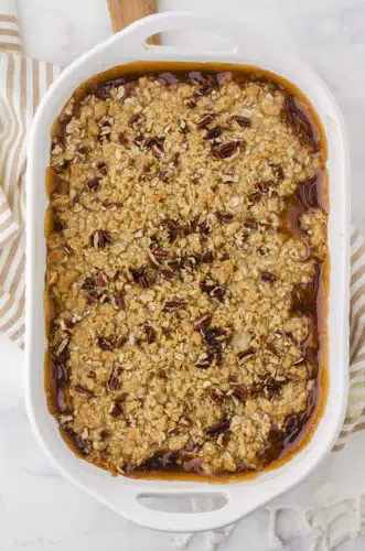 Baked apple crisp with apple pie filling in a 9x13 inch pan.