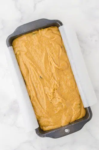 Pumpkin bread batter in a loaf pan