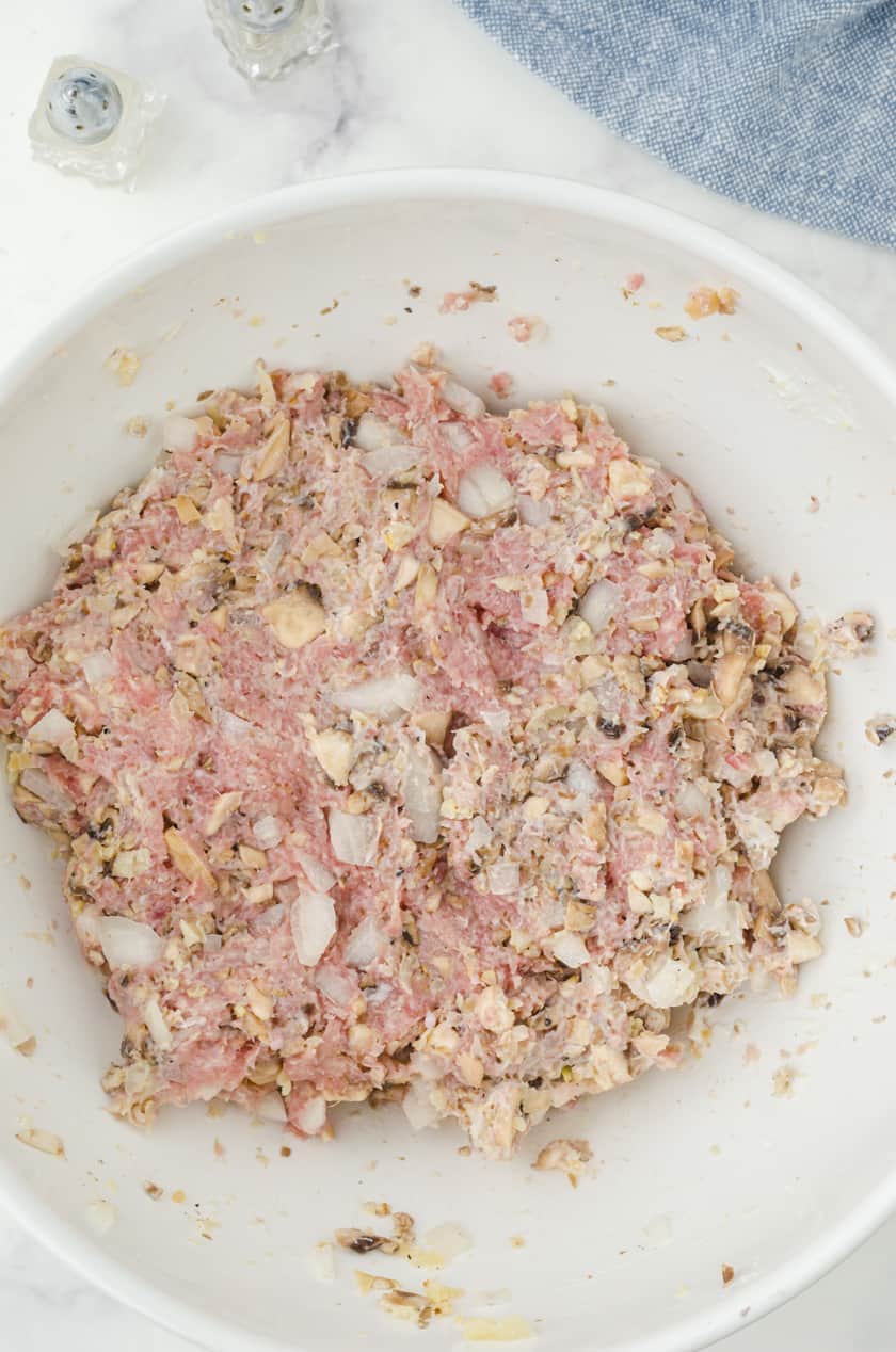 Mix the ingredients for turkey burgers in a large mixing bowl.