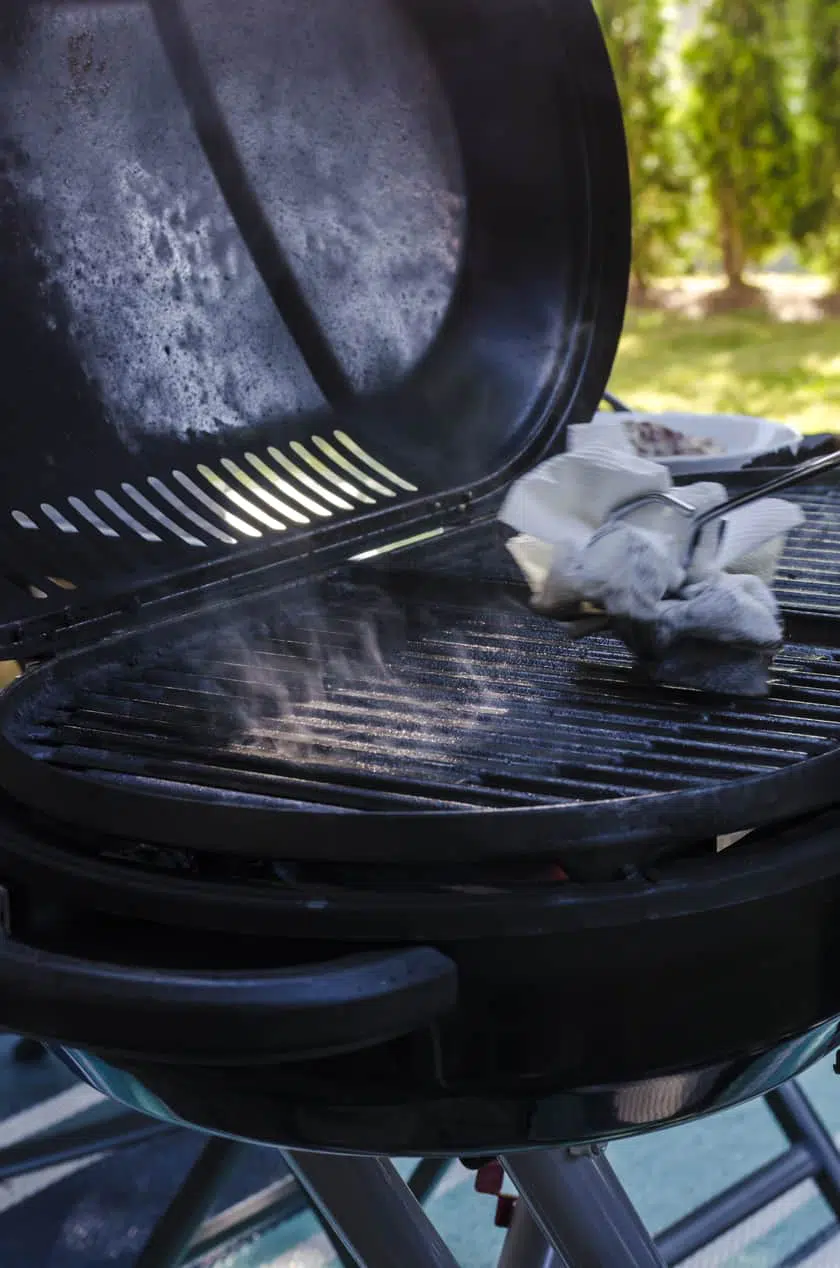 Rubbing oil on the grates of a barbecue