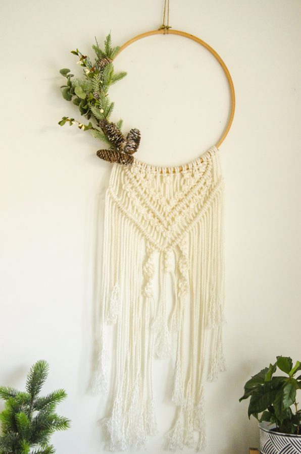 Macrame Wall Hanging Wreath done on an embroidery hoop with Faux Christmas greenery