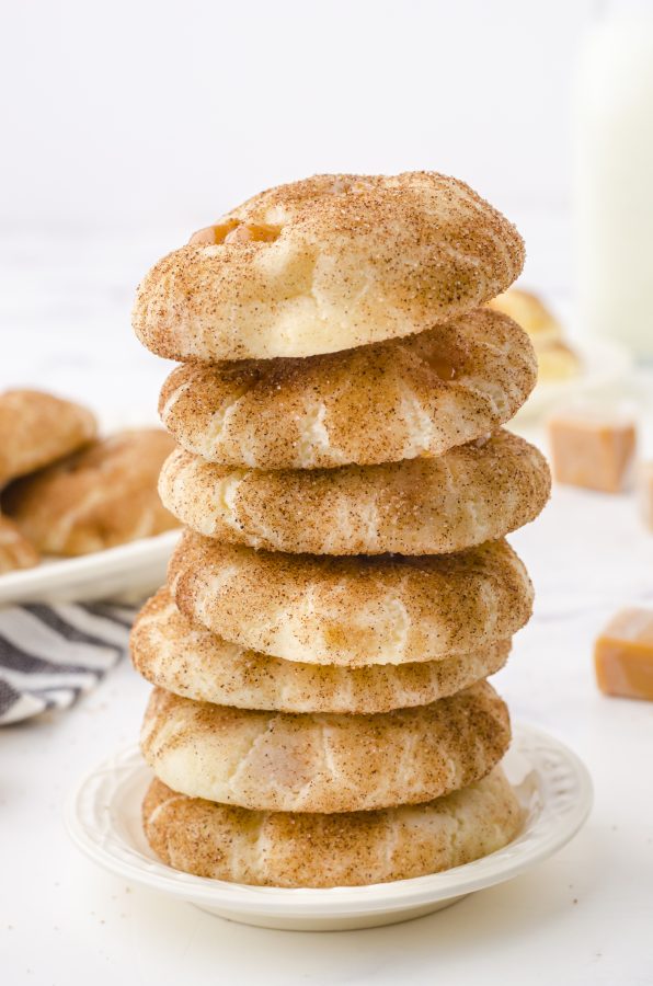 a stack of soft and chewy snickerdoodle caramel bits cookies