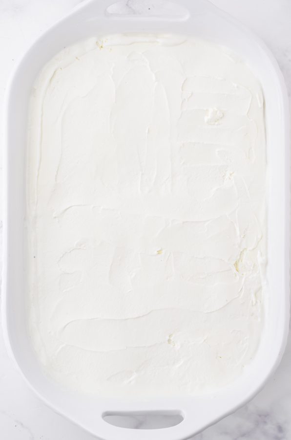 ice cream spread on top of oreo crust for an oreo ice cream cake