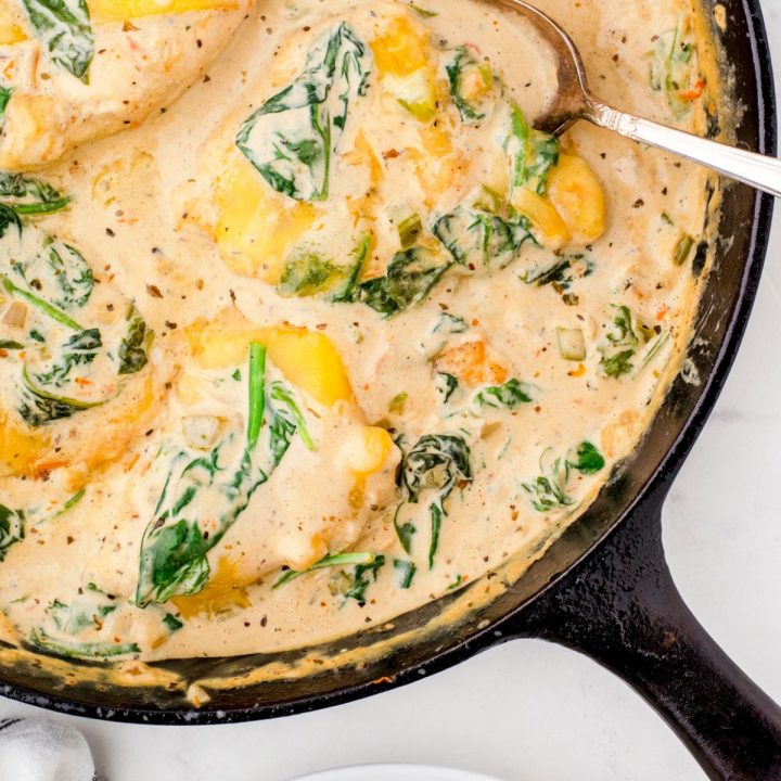 Chicken florentine in a cast iron skillet ready to serve.