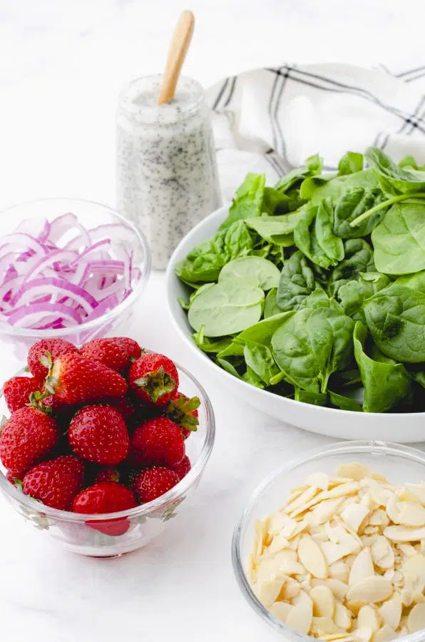 Ingredients for a strawberry and spinach salad.