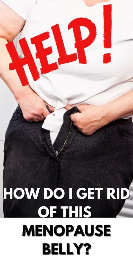 A woman trying to button her jeans but they won't close!