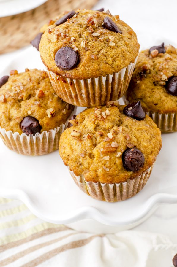 Banana Pumpkin muffins stacked on a plate.