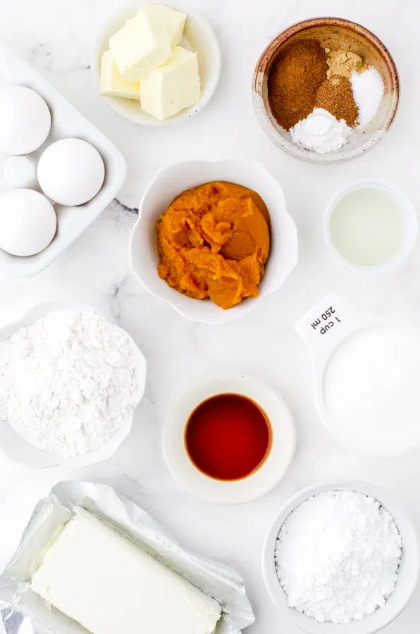 Ingredients for pumpkin roll cake with cream cheese filling