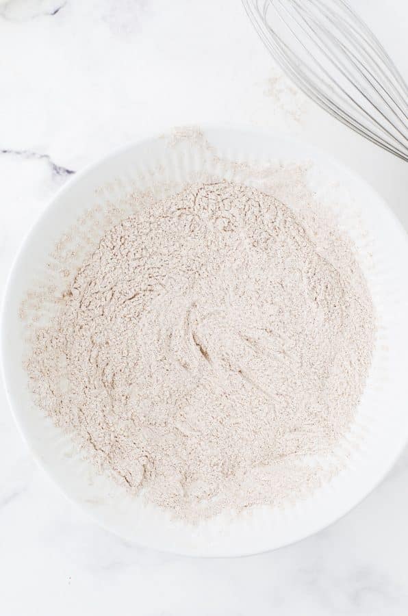 Dry ingredients for pumpkin cake mixed in a seperate bowl