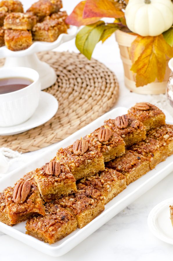 platter of stacked pecan pie bars ready to be served to guests.
