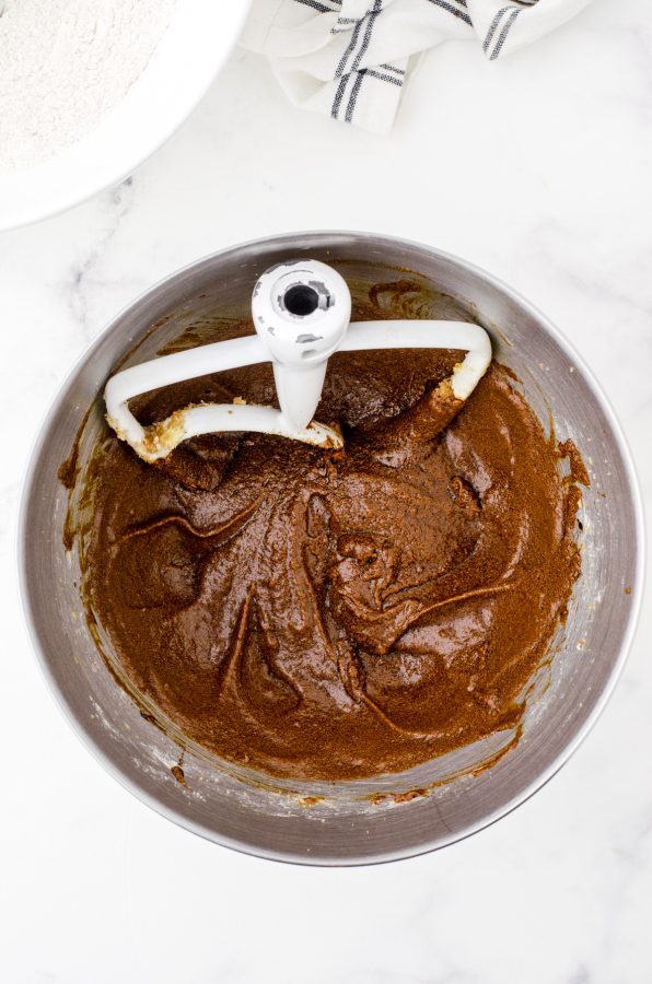 The wet ingredients for easy gingerbread recipe after they have been beaten together with an electric mixer.
