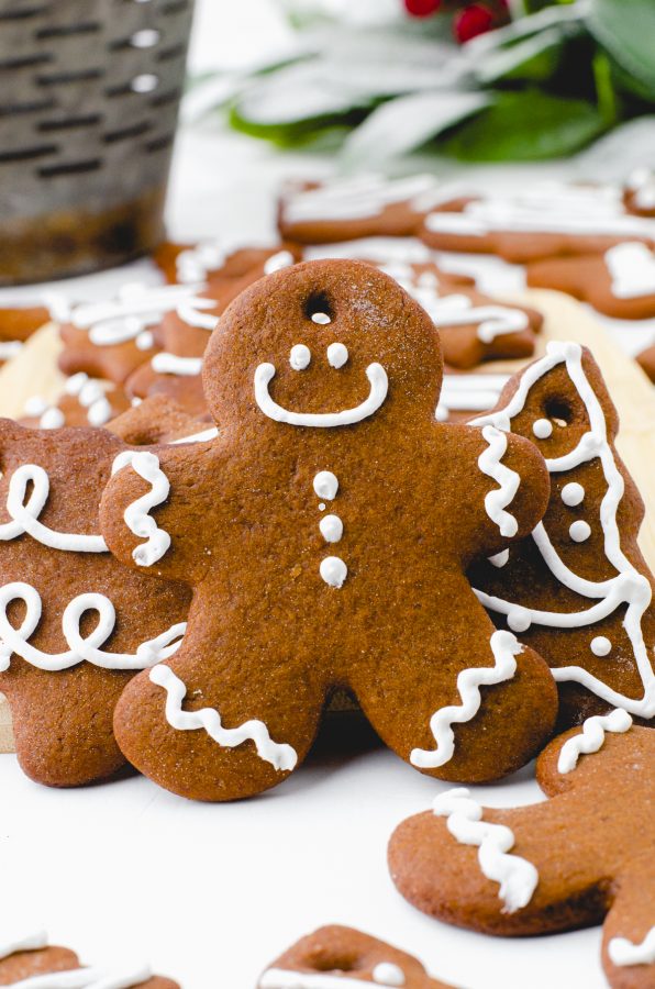 A gingerbread man cookie decorated with a smiley face.